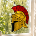 Finished Roman helmet stained glass suncatcher hanging in a sunny window
