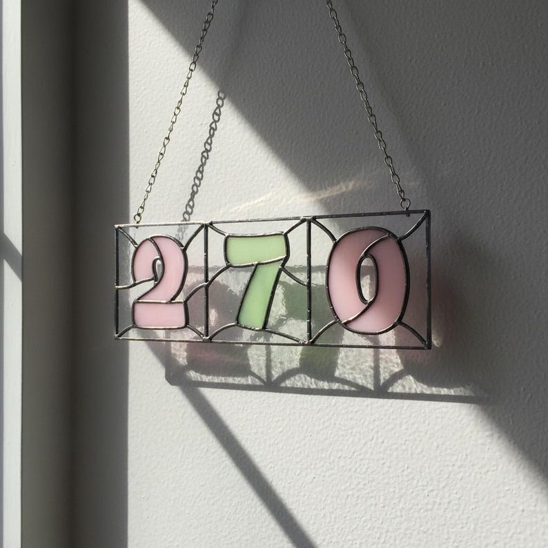 Finished stained glass house number sign showing 270